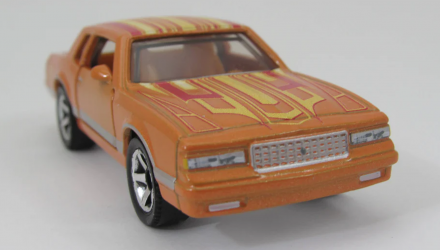 Тематична Машинка Matchbox 1988 Chevy Monte Carlo LS Super Chase Moving Parts 1:64 JBX04 Orange - Retromagaz, image 1